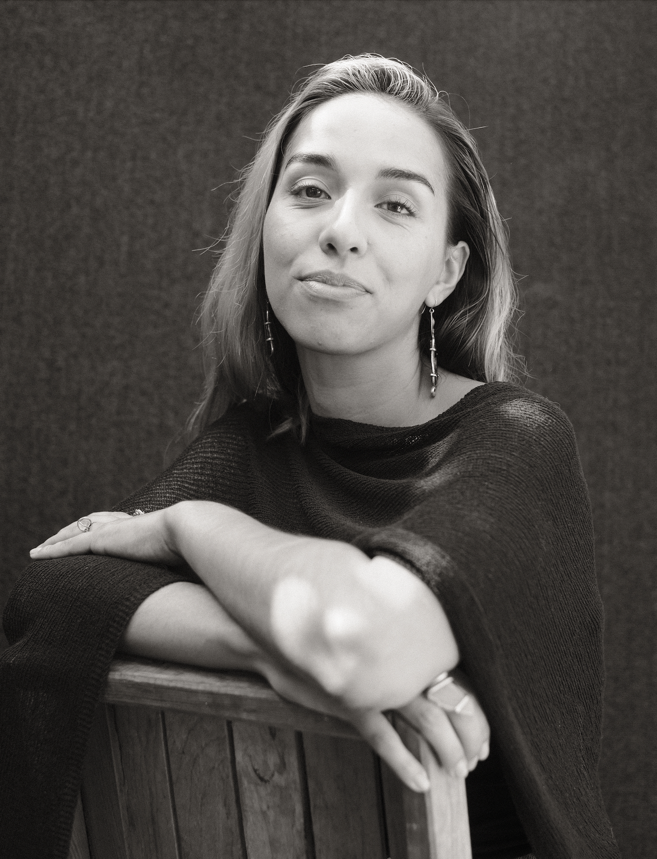 A black and white portrait of Claudia
